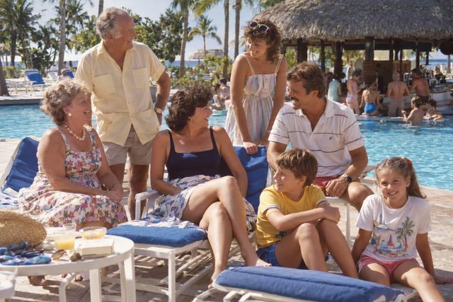 Three generations, one enormous pool, and nobody quite ready for the photograph.