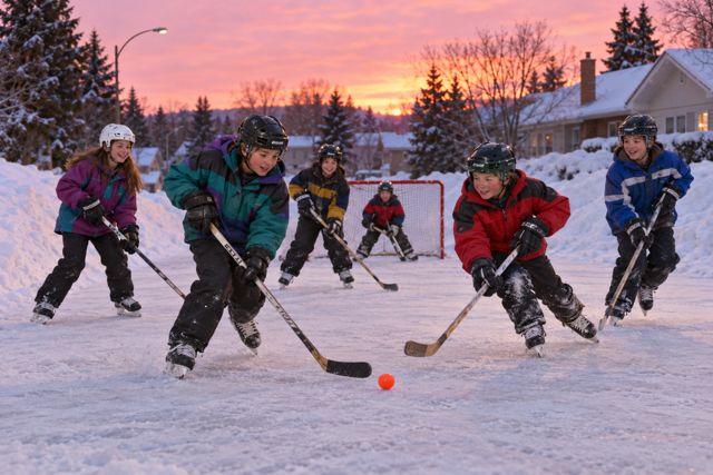 Snowbanks, bright winter jackets, and a neighbourhood hockey game that keeps going until supper.